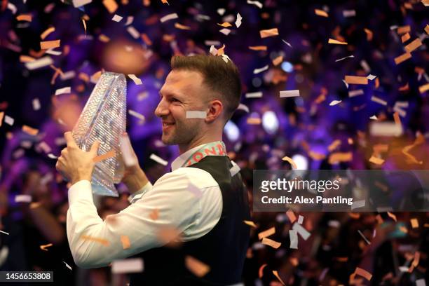 Judd Trump of England celebrates with the Paul Hunter trophy following his victory in the Cazoo Masters Final against Mark Williams of Wales at...