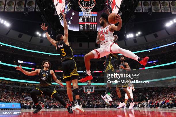 Coby White of the Chicago Bulls passes the ball against the Golden State Warriors during the second half at United Center on January 15, 2023 in...