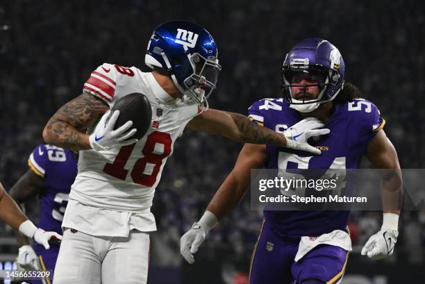 Isaiah Hodgins of the New York Giants runs for a touchdown after catching a pass during the third quarter against the Minnesota Vikings in the NFC...