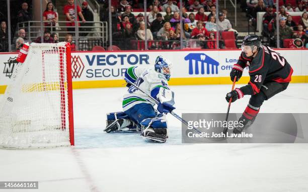 Sebastian Aho of the Carolina Hurricanes scores a goal against Collin Delia of the Vancouver Canucks during the third period at PNC Arena on January...