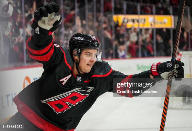 Sebastian Aho of the Carolina Hurricanes celebrates after scoring a goal during the third period against the Vancouver Canucks at PNC Arena on...