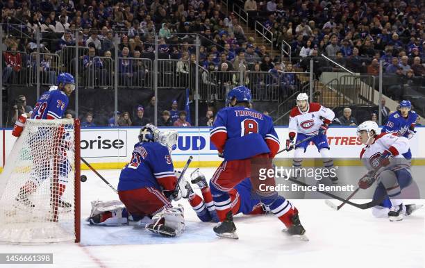 Cole Caufield of the Montreal Canadiens scores the game-winning goal at 8:56 of the third period against Igor Shesterkin of the New York Rangers at...
