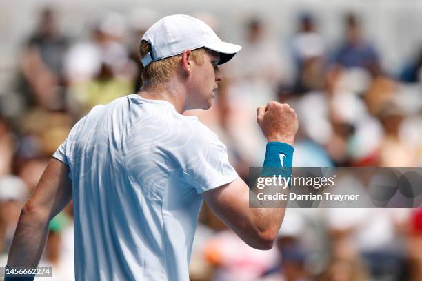 Kyle Edmund of Great Britain reacts in their round one singles match against Jannik Sinner of Italy during day one of the 2023 Australian Open at...