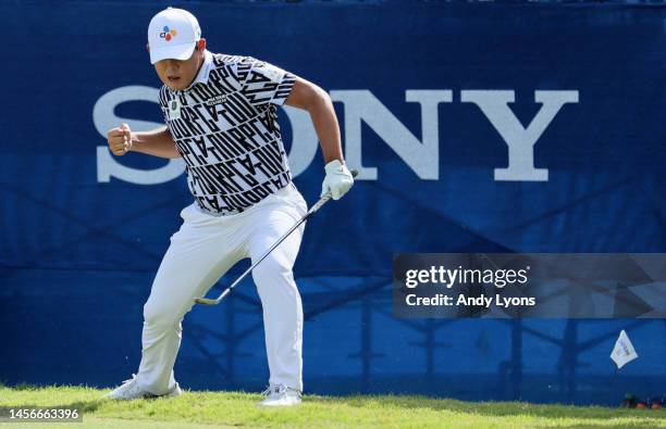 Si Woo Kim of South Korea reacts to his birdie putt on the 18th green during the final round of the Sony Open in Hawaii at Waialae Country Club on...
