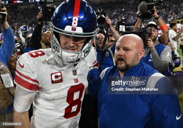 Daniel Jones and head coach Brian Daboll of the New York Giants are seen after defeating the Minnesota Vikings in the NFC Wild Card playoff game at...