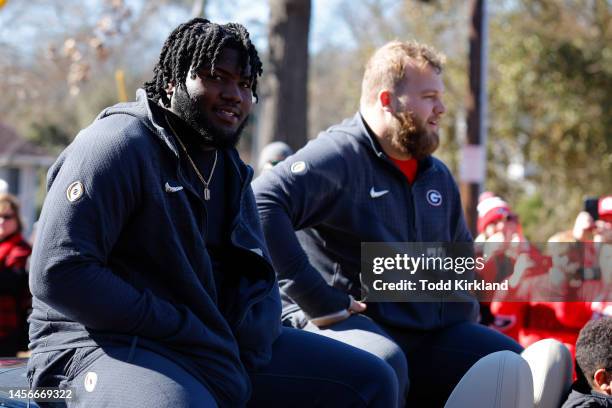 Bear Alexander and Weston Wallace of the Georgia Bulldogs ride along during the parade honoring the Georgia Bulldogs national championship victory on...