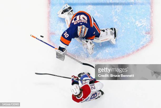 Christian Dvorak of the Montreal Canadiens skates against Ilya Sorokin of the New York Islanders at the UBS Arena on January 14, 2023 in Elmont, New...