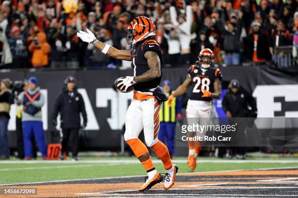 Ja'Marr Chase of the Cincinnati Bengals celebrates after scoring a 7 yard touchdown against the Baltimore Ravens during the second quarter in the AFC...