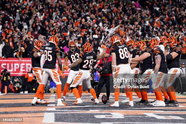 Ja'Marr Chase of the Cincinnati Bengals celebrates with his teammates after scoring a 7 yard touchdown against the Baltimore Ravens during the second...