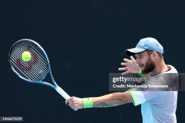 Corentin Moutet of France plays a backhand in their round one singles match against Yibing Wu of China during day one of the 2023 Australian Open at...