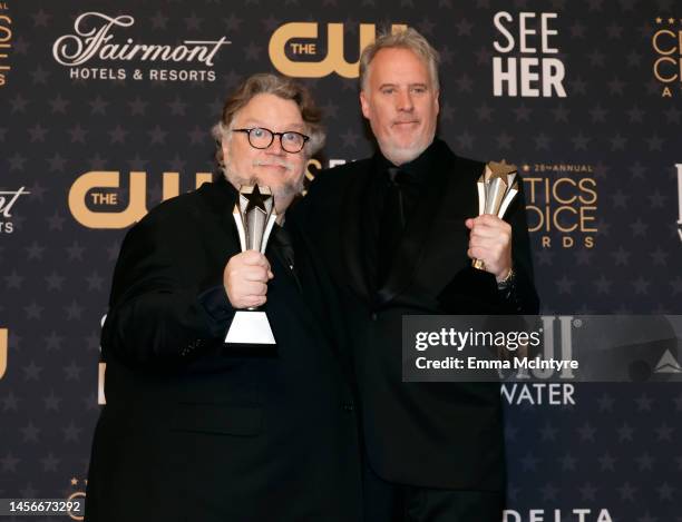 Guillermo del Toro and Mark Gustafson, winners the Best Animated Feature award for "Guillermo del Toro's Pinocchio", pose in the press room during...