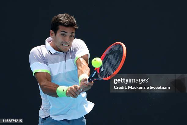 Cristian Garin of Chile plays a backhand in their round one singles match against Sebastian Korda of the United States during day one of the 2023...