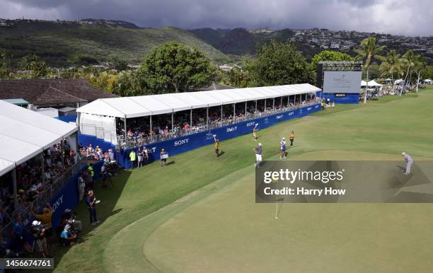 Si Woo Kim of South Korea putts for Eagle on the 18th green during the final round of the Sony Open in Hawaii at Waialae Country Club on January 15,...