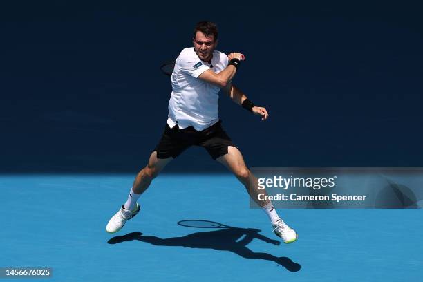 Pedro Martinez of Spain plays a forehand in their round one singles match against Hubert Hurkacz of Poland during day one of the 2023 Australian Open...