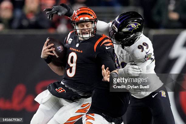 Odafe Oweh of the Baltimore Ravens sacks Joe Burrow of the Cincinnati Bengals during the second quarter in the AFC Wild Card playoff game at Paycor...