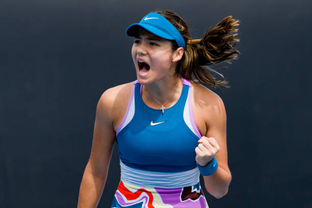Emma Raducanu of Great Britain celebrates winning a point during the round one singles match against Tamara Korpatsch of Germany during day one of...