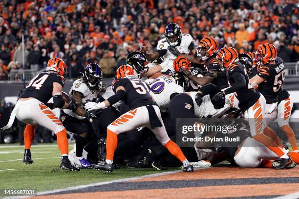 Sam Hubbard of the Cincinnati Bengals recovers a fumble by Tyler Huntley of the Baltimore Ravens to score a 98 yard touchdown during the fourth...