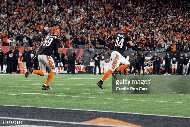 Sam Hubbard of the Cincinnati Bengals runs down the field after recovering a fumble by Tyler Huntley of the Baltimore Ravens to score a 98 yard...
