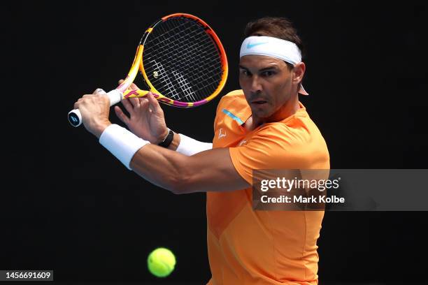 Rafael Nadal of Spain plays a backhand in their round one singles match against Jack Draper of Great Britain during day one of the 2023 Australian...