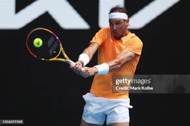 Rafael Nadal of Spain plays a backhand in their round one singles match against Jack Draper of Great Britain during day one of the 2023 Australian...