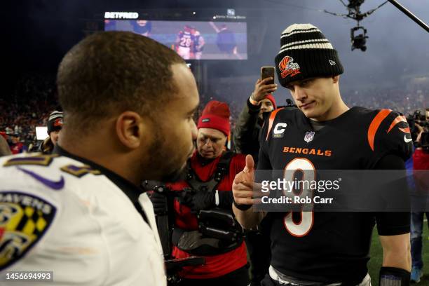 Joe Burrow of the Cincinnati Bengals points to J.K. Dobbins of the Baltimore Ravens after the AFC Wild Card playoff game at Paycor Stadium on January...