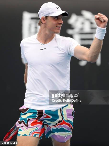 Denis Shapovalov of Canada celebrates match point in their round one singles match against Dusan Lajovic of Serbia during day one of the 2023...