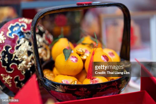 traditional chinese wedding basket "double happiness" symbol on fresh oranges - gift baskets stock pictures, royalty-free photos & images