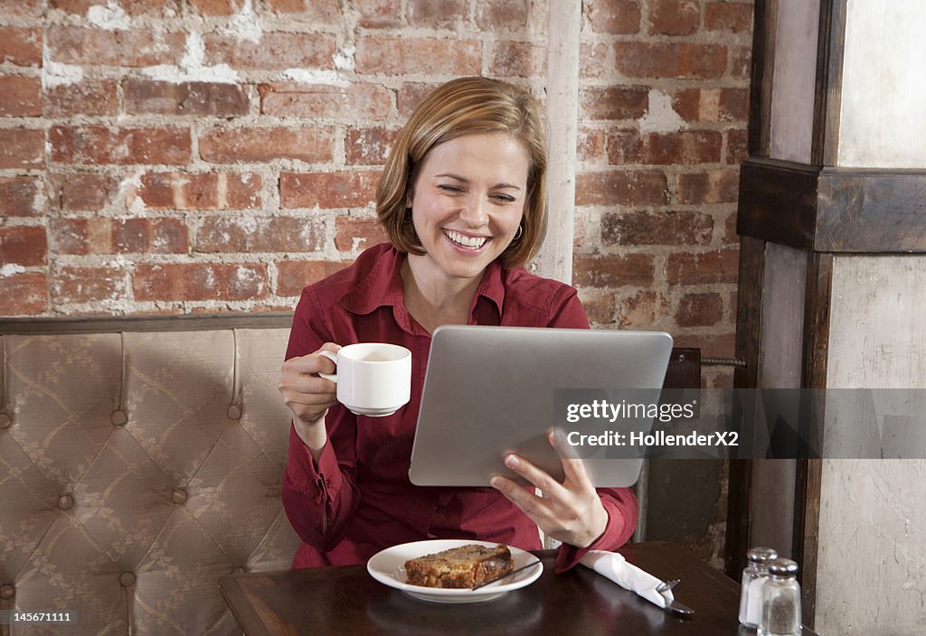 Virtual friendship with tablet at coffee shop