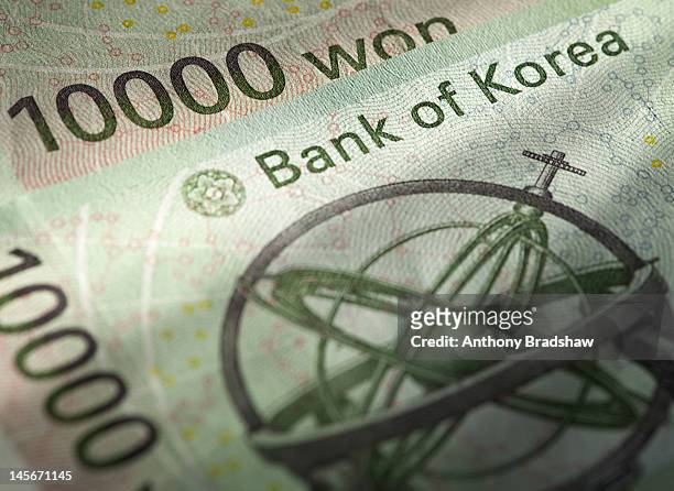 close up detail of korean won currency - 韓国の通貨 ストックフォトと画像