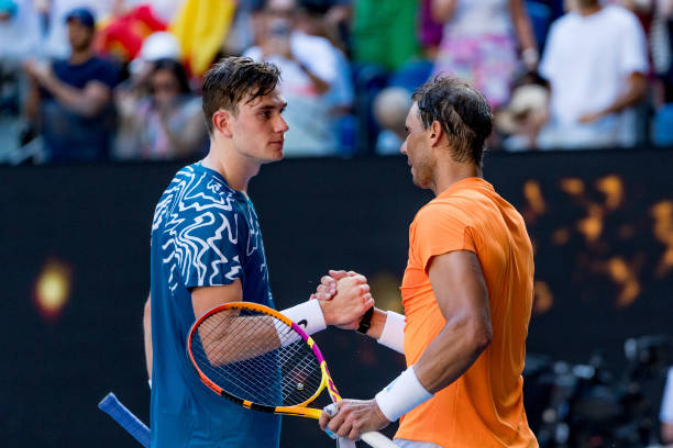 Rafael Nadal of Spain shakes hands with Jack Draper of Great Britain after winning their round one singles match during day one of the 2023...