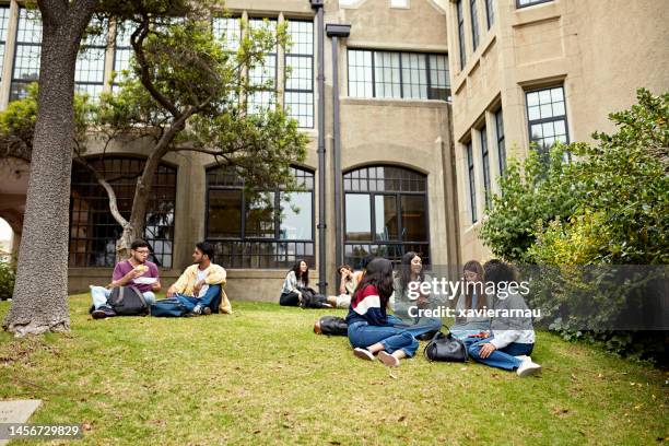 young friends taking a break between college classes - campus bildbanksfoton och bilder