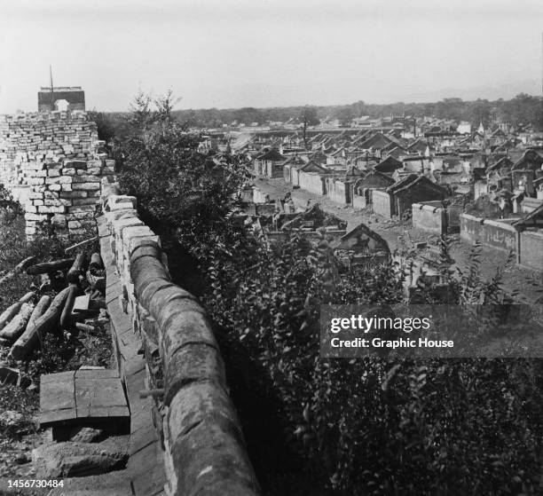 Defences built by Boxers on a Wall near the South Gate, with ruins visible in the distance, during the Boxer Rebellion in Beijing, China, circa 1901....