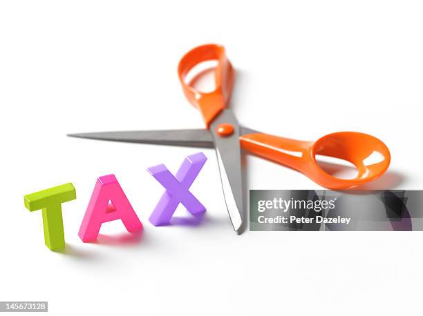 cutting taxes - tassa foto e immagini stock