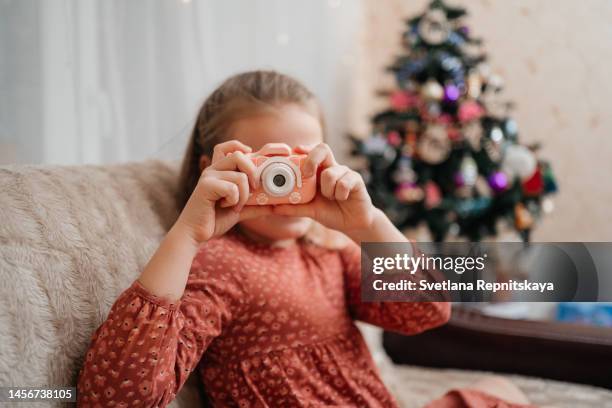 child with toy camera - toy camera stock pictures, royalty-free photos & images