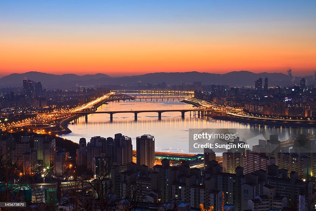 Cityscape with river before sunrise