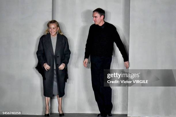 Fashion designers Miuccia Prada and Raf Simons walk the runway during the Prada Ready to Wear Fall/Winter 2023-2024 fashion show as part of the Milan...