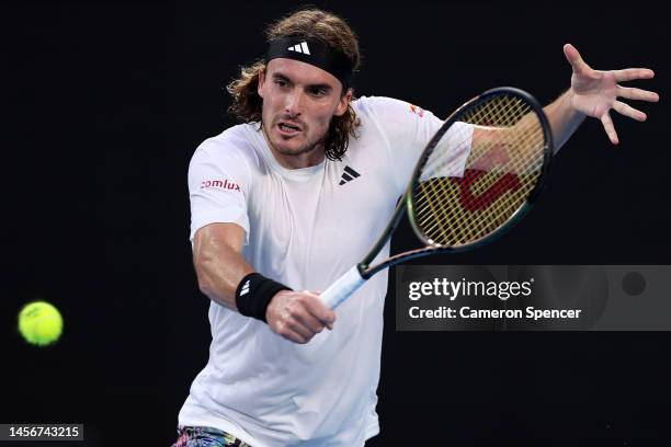 Stefanos Tsitsipas of Greece plays a backhand in their round one singles match against Quentin Halys of France during day one of the 2023 Australian...