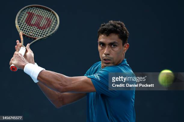 Thiago Monteiro of Brazil plays a backhand in their round one singles match against Constant Lestienne of France during day one of the 2023...