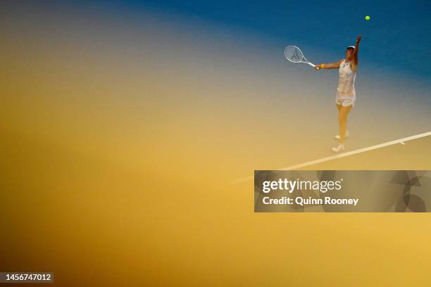 Iga Swiatek of Poland serves in their round one singles match against Julie Niemeier of Germany during day one of the 2023 Australian Open at...