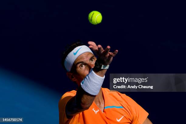 Rafael Nadal of Spain serves in the round one singles match against Jack Draper of Great Britain during day one of the 2023 Australian Open at...