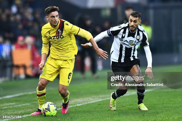 Nikola Moro of Bologna FC competes for the ball with Roberto Pereyra of Udinese Calcioduring the Serie A match between Udinese Calcio and Bologna FC...