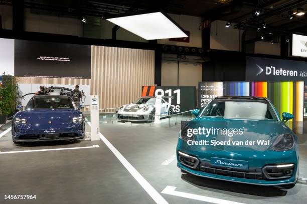 Panamera 4S E-Hybrid Sport Turismo, Porsche Tacan 4S and Porsche 911 GT3 RS on display at Brussels Expo on January 13, 2023 in Brussels, Belgium.