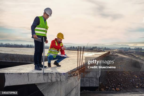 engineer and investor on a road construction site - serbia bridge stock pictures, royalty-free photos & images