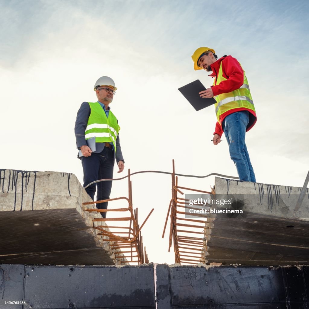 Engineer and investor on a road construction site