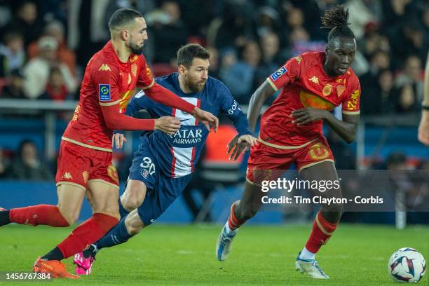 January 11: Lionel Messi of Paris Saint-Germain defended by Batista Mendy of Angers and Nabil Bentaleb of Angers during the Paris Saint-Germain V...