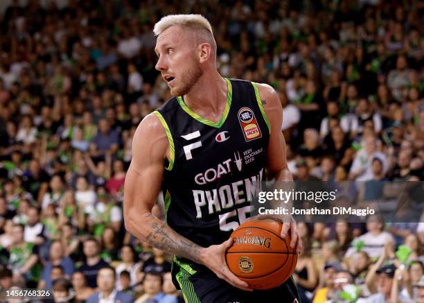 Mitchell Creek of the Phoenix rebounds during the round 15 NBL match between South East Melbourne Phoenix and Brisbane Bullets at State Basketball...