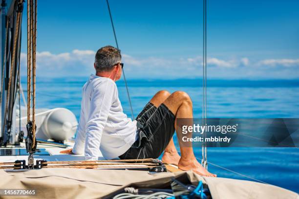 crew member enjoying sailing on sailboat - yachting 個照片及圖片檔