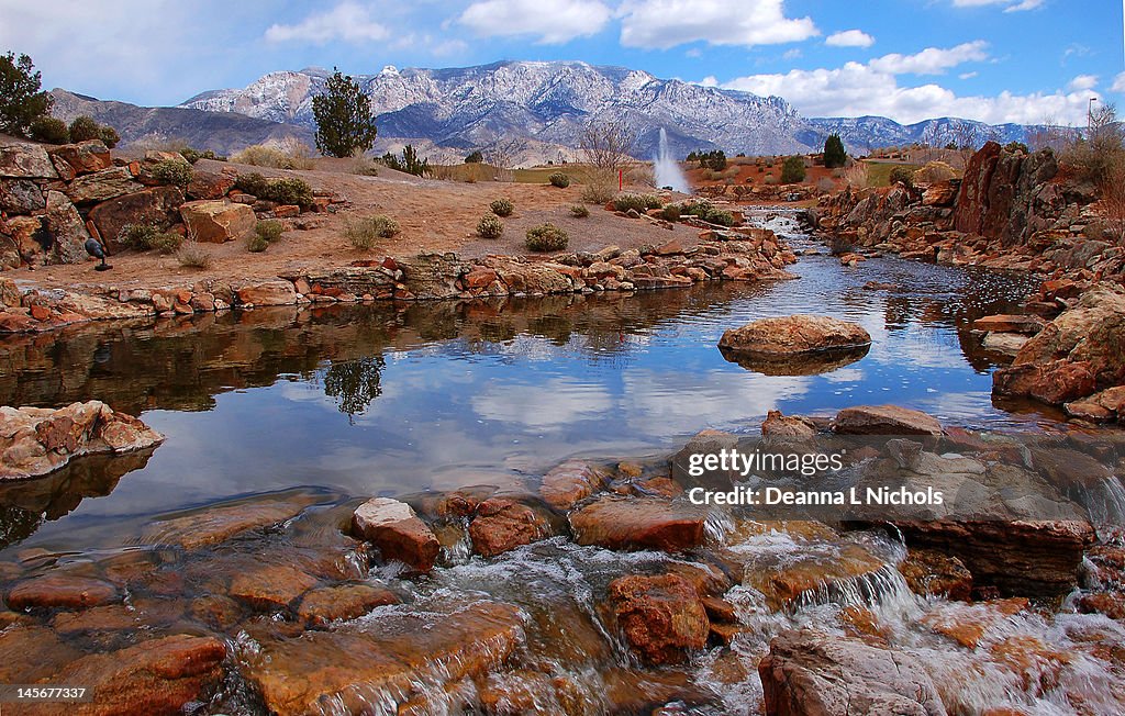 Waterway and Sandia mountains