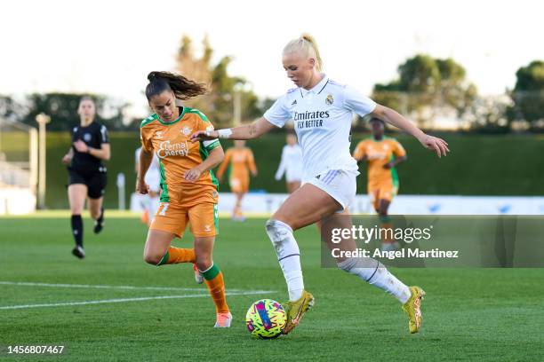 Sofie Svava of Real Madrid is challenged by Nuria Ligero of Real Betis during the Liga F match between Real Madrid and Real Betis at Estadio Alfredo...