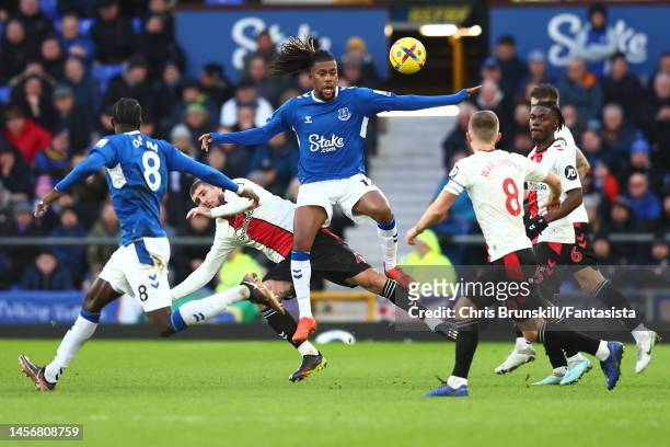 Alex Iwobi of Everton in action with Lyanco of Southampton during the Premier League match between Everton FC and Southampton FC at Goodison Park on...